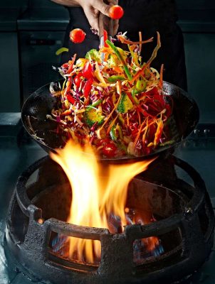 crop-hand-cooking-vegetable-wok-on-pan-2023-11-27-05-36-31-utc_11zon.jpg